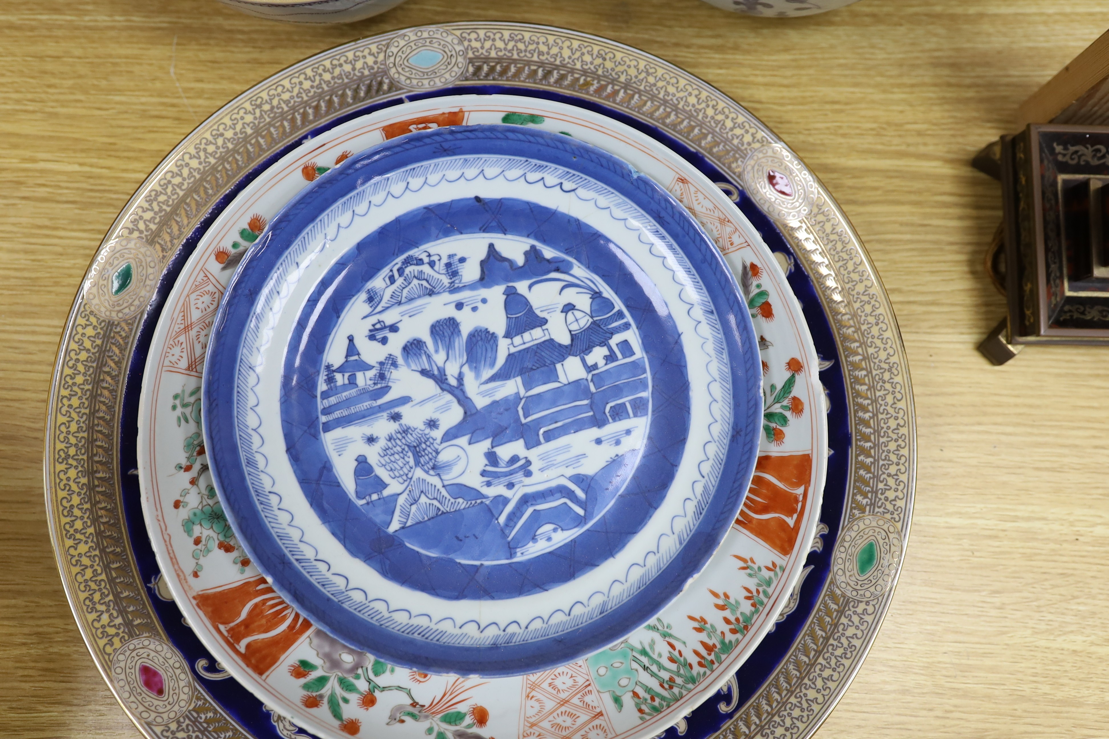 A group of 18th century and later Chinese enamelled and blue and white porcelain dishes and three bowls, Largest dish 35.5 cm diameter